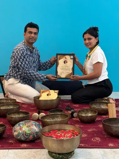 I am honored to present a certificate to a graduate, acknowledging her commitment to learning the art of sound therapy.