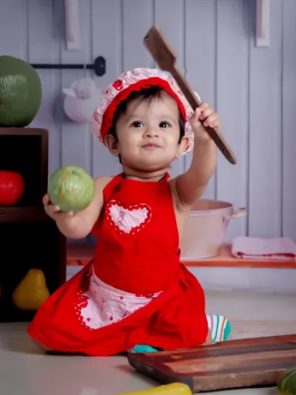 Little Chef in the making. Cooking up cuteness one recipe at a time with a wooden spoon and a big smile.