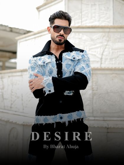 A portrait that captures the bold attitude of the denim patchwork jacket. The distressed denim and black base create a powerful contrast.