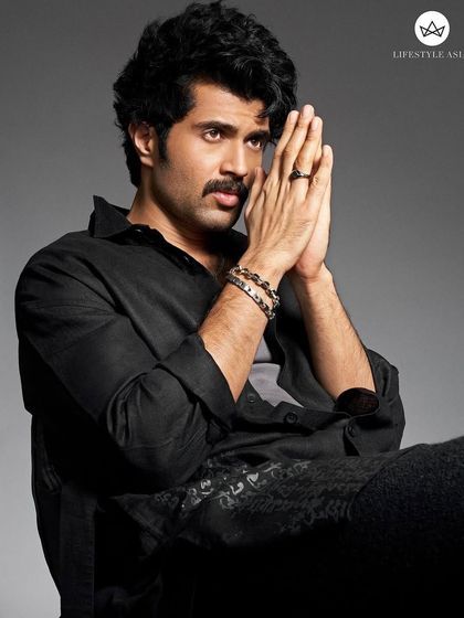 Another look from the Lifestyle Asia shoot, showcasing a relaxed yet intense mood. The all-black outfit from his brand Rowdy Club serves as a canvas for the striking Men of Platinum accessories.