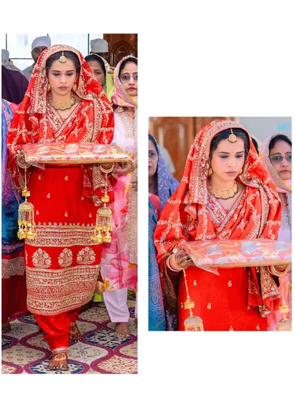 A full view of the bride's grand entrance. Her traditional red Punjabi suit, complete with chooda and kalira, makes for a stunning and regal bridal look.