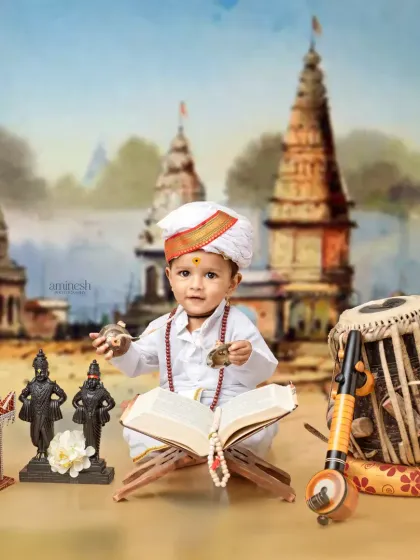A full studio setup for the Varkari theme, with the baby boy playing with cymbals. The scene includes idols, musical instruments, and a backdrop of the holy city of Pandharpur.