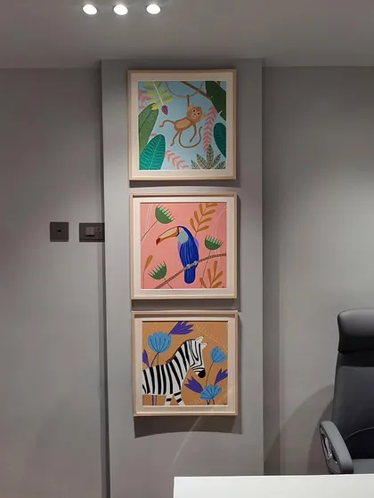 This custom set of three framed paintings was created for a child's room. The series features a playful monkey, a colorful toucan, and a friendly zebra, all designed with a fun, pastel aesthetic to create a cheerful atmosphere.