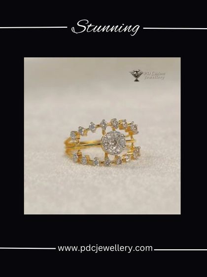 A stunning and unique diamond ring design in 18kt hallmarked gold. The open-work band is studded with diamonds, leading to a beautiful central cluster.