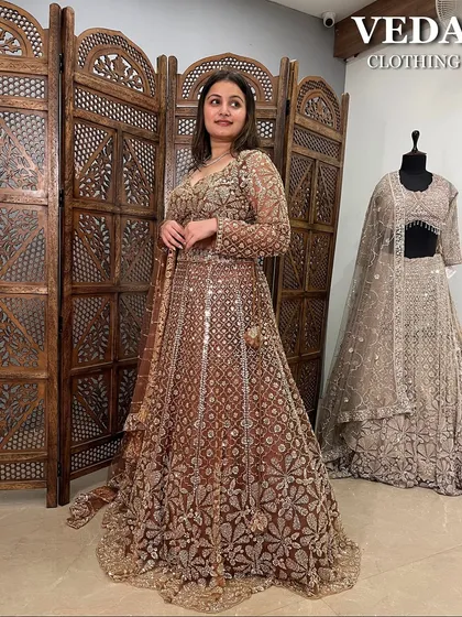 The way the light hits the sequins on this bronze lehenga is just magical. A true party-ready outfit.
