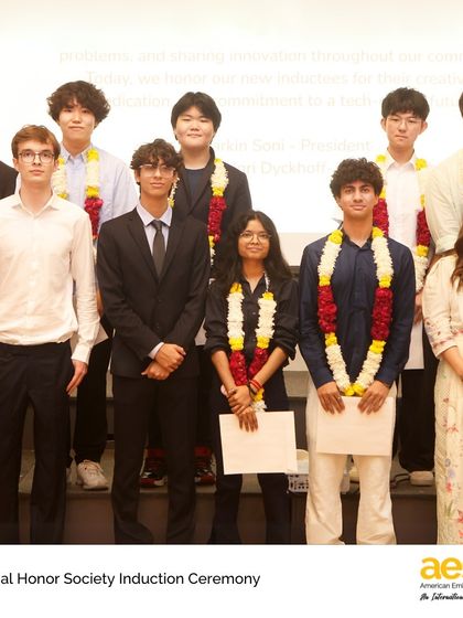 A group of newly inducted Honor Society members stands with their faculty advisor. These societies are student-led, providing valuable opportunities for leadership and service.