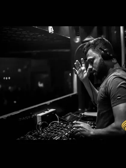 A black and white shot capturing the intensity and focus required during a peak-hour set at Opa Bar and Cafe. It's about channeling all my energy into the music and the crowd in front of me.