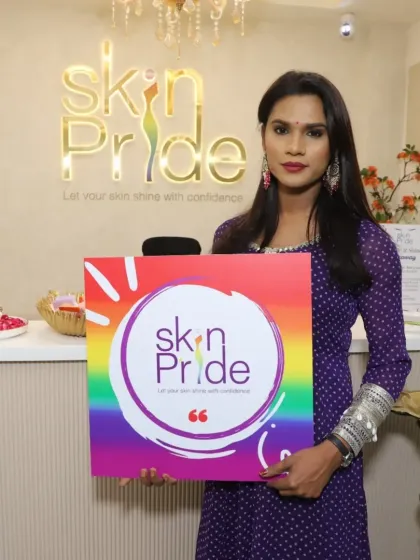 A confident client posing at our clinic's reception. We are dedicated to providing real results that empower you to feel your best. Thank you for being a part of the Skin Pride family.