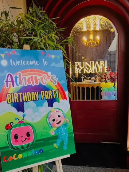 A personalized welcome sign is a great way to greet guests. This one was designed for Atharv's Cocomelon party.