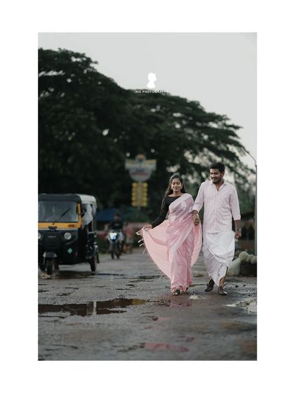A shot of the couple walking down a rustic road at sunset. This captures a simple, beautiful moment of them starting their journey together.
