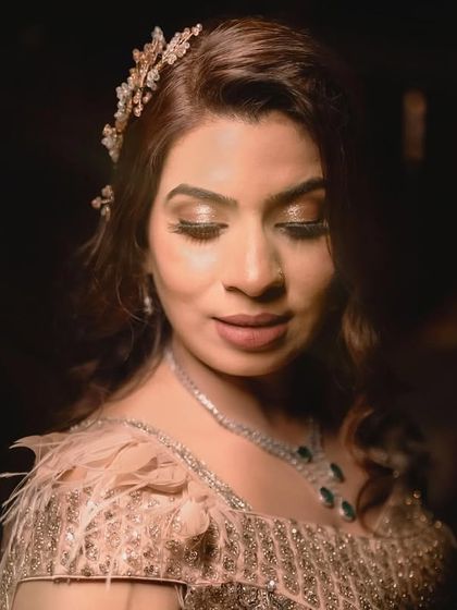 A stunning close-up portrait of the bride-to-be on her engagement day, capturing her radiant smile and elegant jewelry.