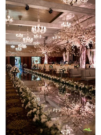 For this event, I designed a grand entrance with a fully mirrored aisle reflecting elegant, blossoming cherry trees and crystal chandeliers. This level of detail creates a luxurious and impressive experience for guests from the moment they arrive.