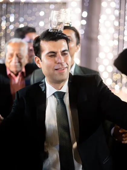 Guests enjoying the party and showing off their dance moves.