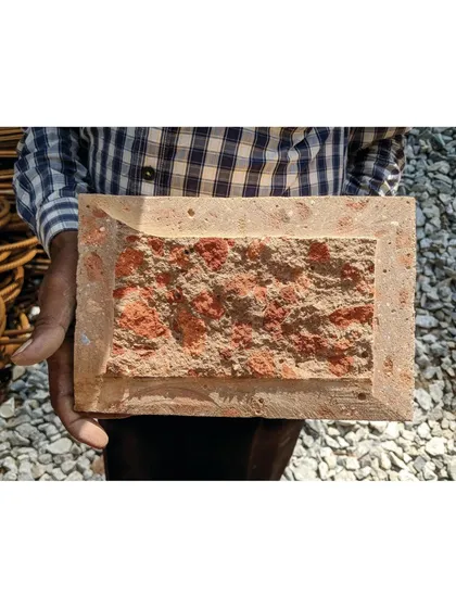 This is the story behind our Debris Block House. We developed a unique, sustainable building material by creating mud blocks from the debris of the original structure on the site, revealing a hidden texture when cut open.