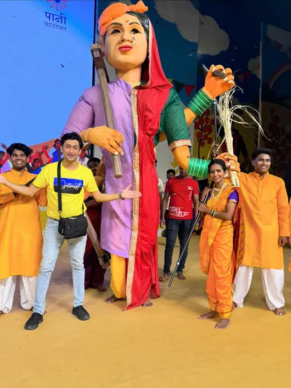 A full view of the Bali Raja puppet on stage with the performers. It takes a team to bring a character of this size to life, and I'm incredibly proud of the dancers who operated it so skillfully.