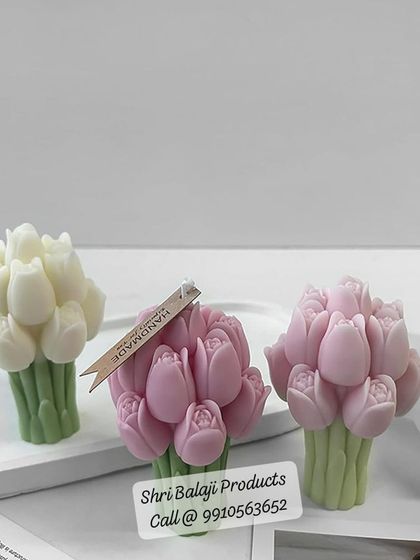 These lovely tulip bouquet candles in white and pink showcase a clean, minimalist aesthetic. The mold creates a beautiful bunch of tulips, perfect for modern home decor.