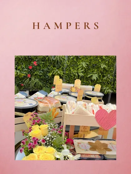 A beautiful display of our hampers, ready for a special event. We combine our food items with fresh flowers and thoughtful packaging to create a memorable gift.