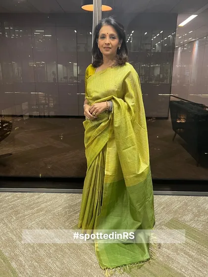 A customer in our lime green Kosa silk saree. The vibrant color and subtle sheen make it a perfect choice for festive occasions and celebrations.