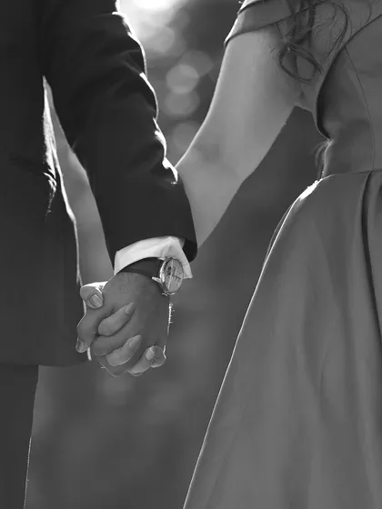 A classic black and white photo of a couple holding hands. This timeless style emphasizes the emotion and connection, proving that sometimes the simplest gestures are the most powerful.