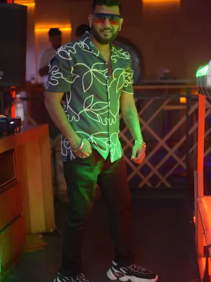 Full-length shot showing off my style. My look is as much a part of the performance as my music.