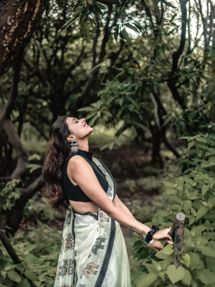 There's a timeless elegance to a saree, especially when set against the raw beauty of nature. I focused on the model's joyful expression and the soft, natural light to create a feeling of classic grace and freedom.