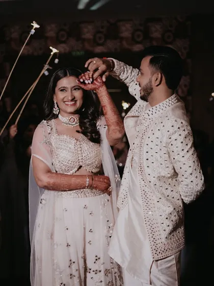 The couple shares a sweet moment during their Sufi Night, making an entrance through an arch of sparklers.
