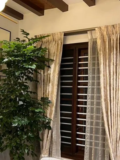 I love using tall plants to draw the eye upward and make a room feel bigger. This Ficus tree was perfect for this spot next to the window, creating a beautiful, natural frame and adding life to the corner.