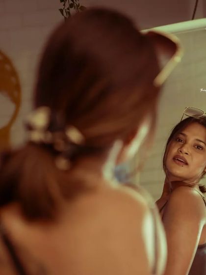 A slightly different take on the mirror shot, with the sunglasses adding a touch of cool.