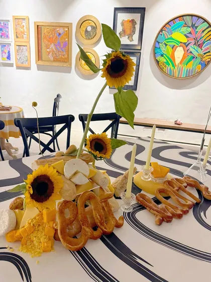 The 'Happy' bread sculpture as part of the larger edible arrangement.