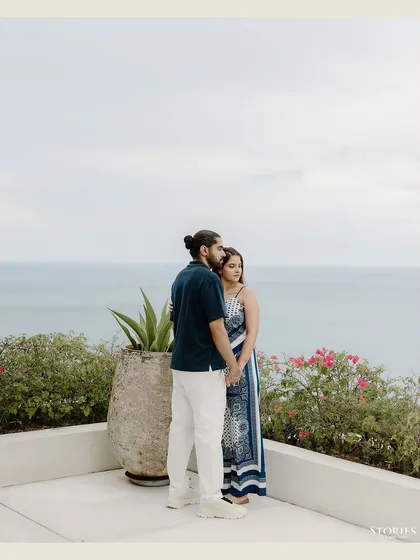 A quiet, contemplative portrait of the couple looking out at the ocean.