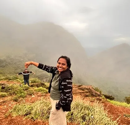 A fun, forced-perspective shot from our Chikmagalur trip, with the misty Western Ghats in the background.