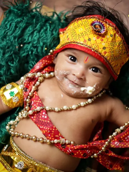 A close-up of a baby Krishna with a little makhan on his face. These adorable, messy moments are what make Janmashtami shoots so much fun.