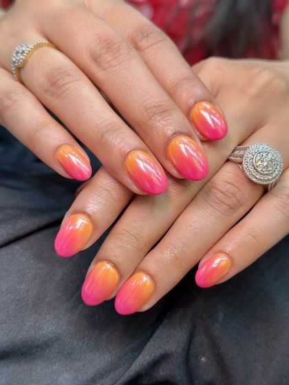 The almond shape of these nails is perfect for showcasing the smooth gradient of the ombre design.
