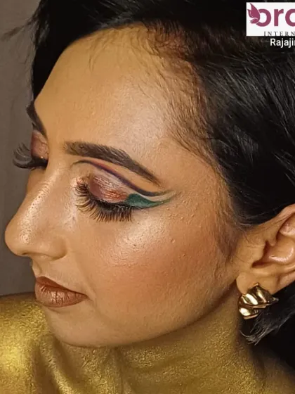 A side profile of the magazine look, showing the sharp, artistic lines of the eye makeup.