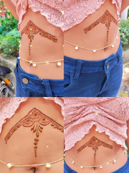 A trendy belly chain tattoo, showing the versatility of henna as body art.