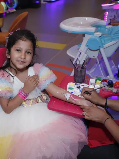 A little girl gets a beautiful design from our tattoo and face painting artist. This is a very popular add-on that makes kids feel special and adds a creative touch to the party.