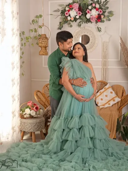A beautiful couple's portrait in my boho studio. The mint green ruffled gown adds a soft, romantic touch to the earthy setting.