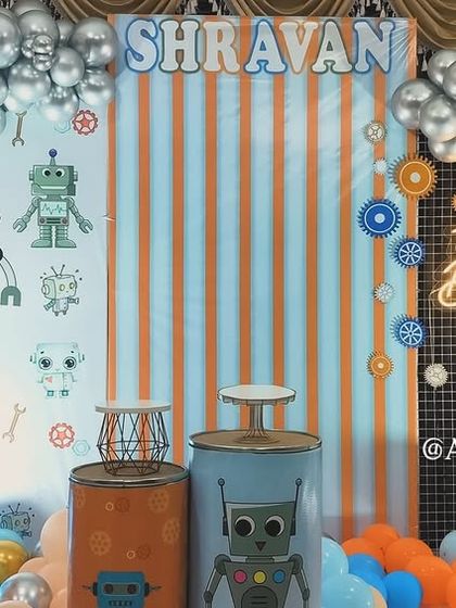For the little one who loves robots, we designed this fun and futuristic robo-themed party. The backdrop features robot graphics, gears, and a cool color palette of orange, blue, and silver.