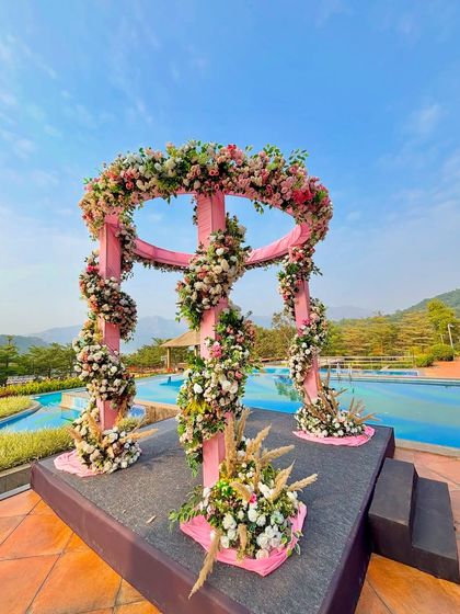 The vibrant colors and beautiful location of this poolside mandap make it an ideal choice for couples looking for a memorable and photogenic ceremony.