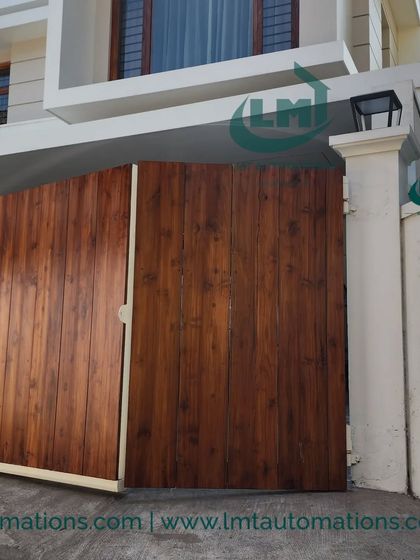 A closer look at the cantilever gate as it opens. The absence of a ground track is a key advantage, providing a seamless transition from the street to the property.