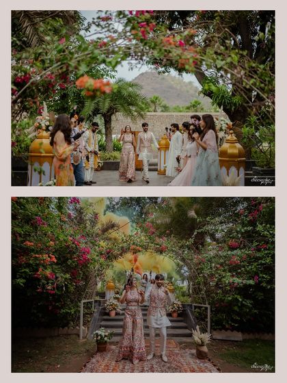 The couple's grand entrance at their Udaipur wedding, full of energy and color.