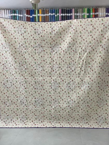 The patterned backing of the hexagon quilt.