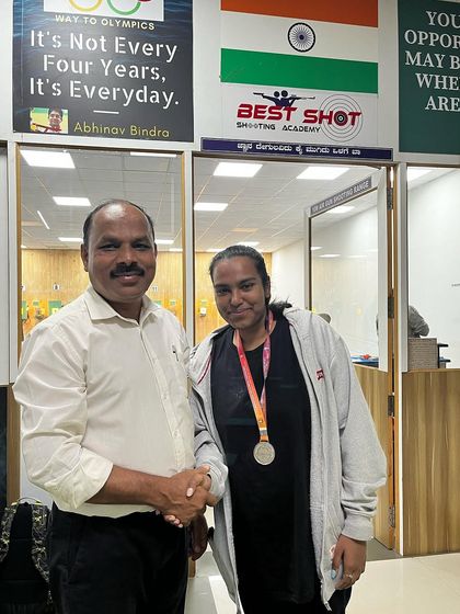 Hrudya with her silver medal, being congratulated by me at the academy.