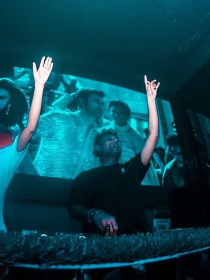 A moment of shared energy with my VJ at a club in Kolkata.