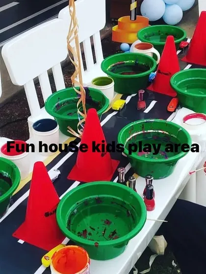 Our white tables set up for a fun painting activity. This shows the versatility of our furniture, perfect for crafts, games, and more, not just for dining.