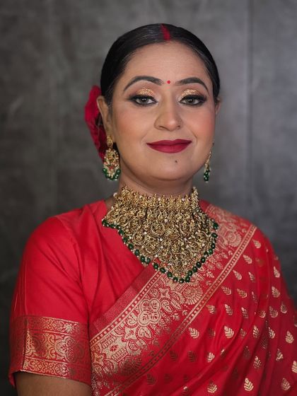 A classic portrait of the reception bride, looking elegant and poised. The makeup is timeless and perfectly suited for the occasion.