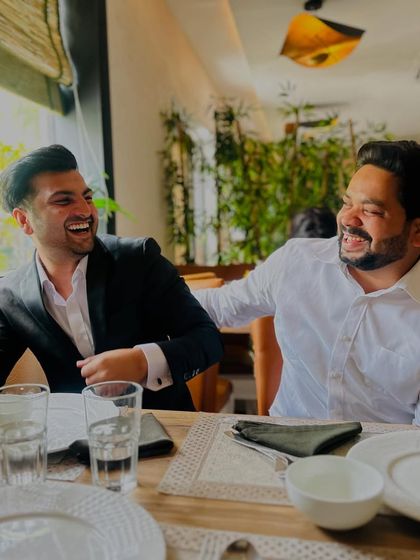 Sharing a light-hearted moment with a friend. Strong personal relationships are essential for a balanced life.