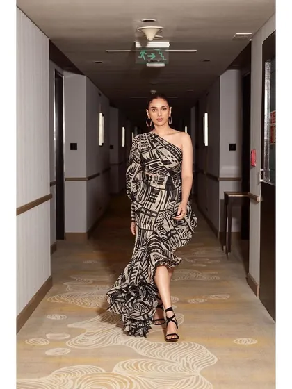 A walking shot down a hallway in the Nikita Mhaisalkar set, showing its incredible movement and graphic impact.