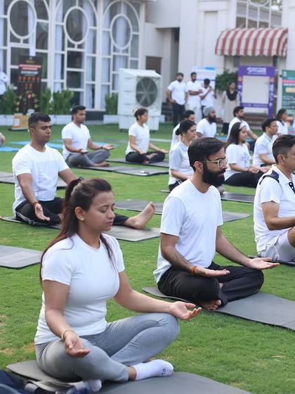 A moment of meditation during our outdoor yoga event. We provide opportunities for both physical activity and mental relaxation.