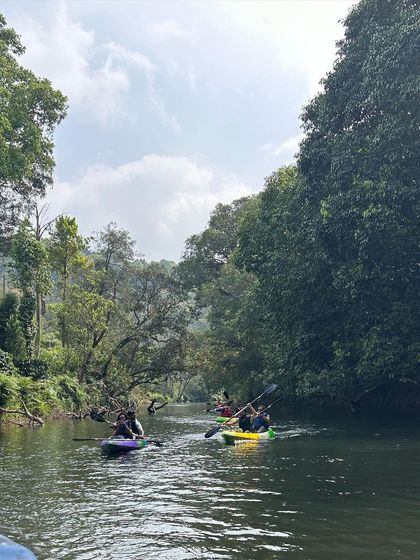 Kayaking on the calm river is a perfect way to unwind and have some fun after the strenuous Kumara Parvatha trek.